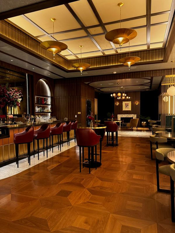 The Nightcap bar, red leather stools, a parquet floor and a coffered ceiling