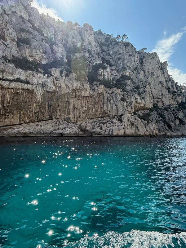 Limestone cliffs over turquoise water in the calanques, from the boat