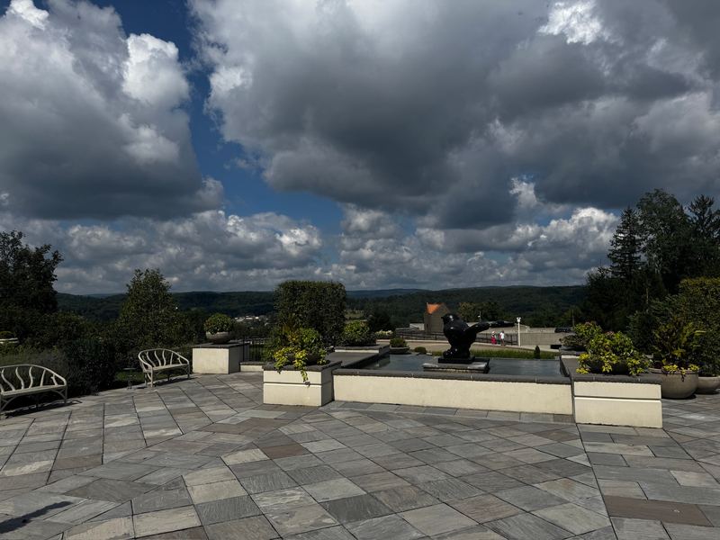 The stone terrace in front of the Chateau, the bronze bird in its pool and storm clouds over the Laurel Highlands