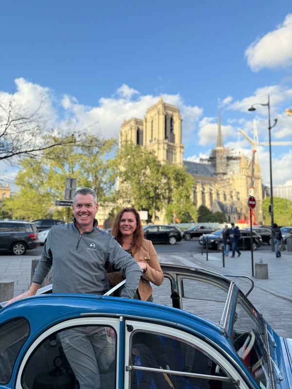 Christina and Colin at Notre-Dame, the new spire up and the scaffolding still on