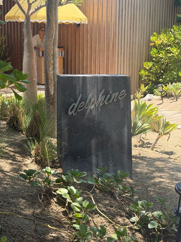The Delphine sign at the beach club.