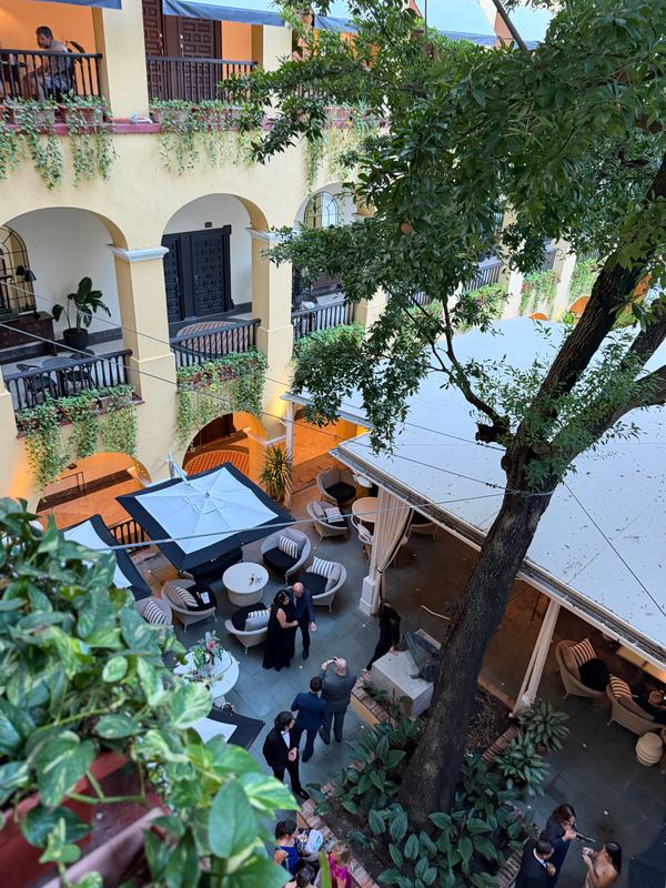 The galleried courtyard at El Convento, around the old nispero tree
