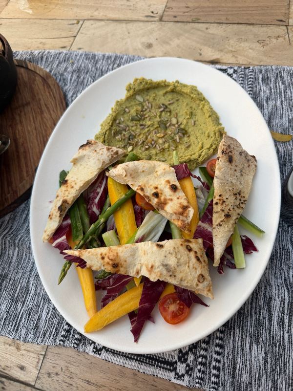 Hummus, grilled flatbread and vegetables at lunch.