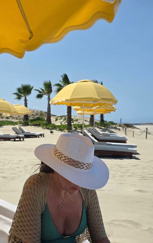 Jeannie under the yellow umbrellas at Delphine.