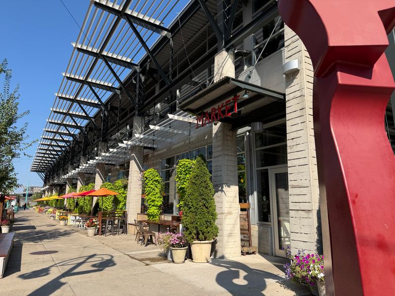 The Milwaukee Public Market on Water Street, the red sculpture at its corner