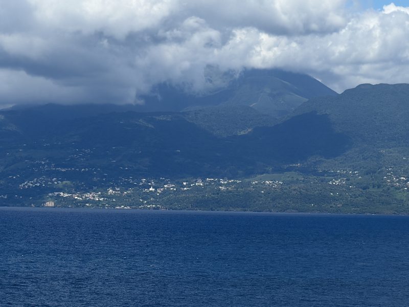 The mountains of Basse-Terre, Guadeloupe, under a cap of cloud, seen across the channel from Les Saintes