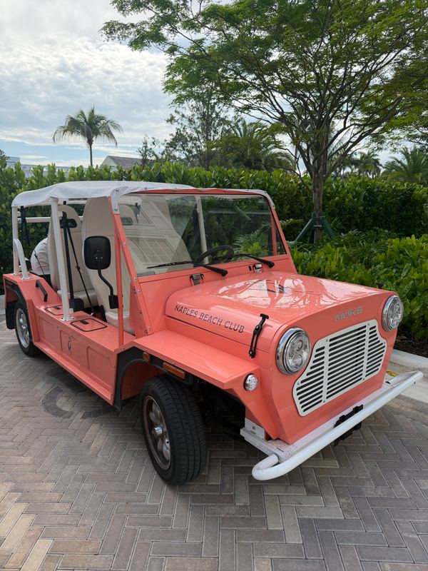 The resort's coral Moke, Naples Beach Club on its bonnet