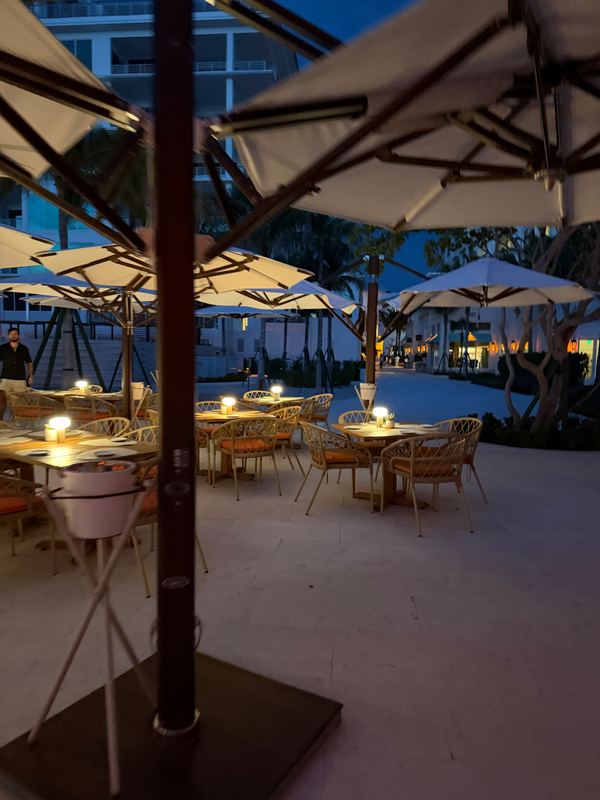 The Sunset Bar: tables under umbrellas at dusk