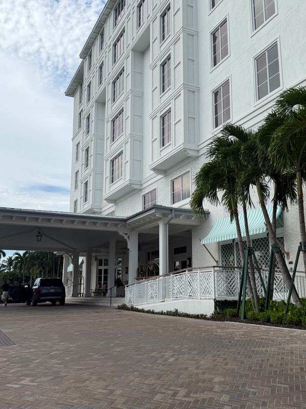The hotel from the drive: the porte-cochère and the striped awning