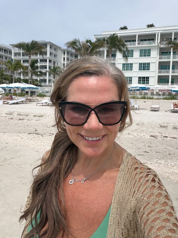 Jeannie on the beach in front of the resort
