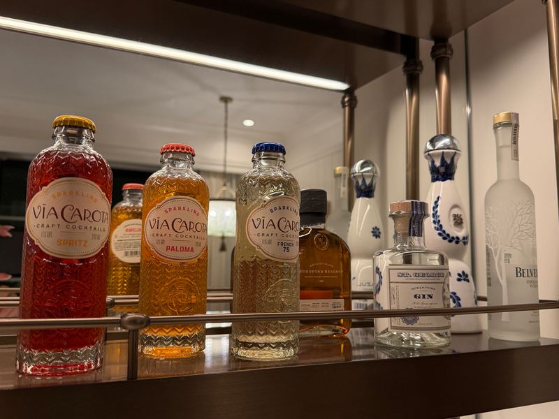 The minibar shelf: craft cocktail bottles and local spirits