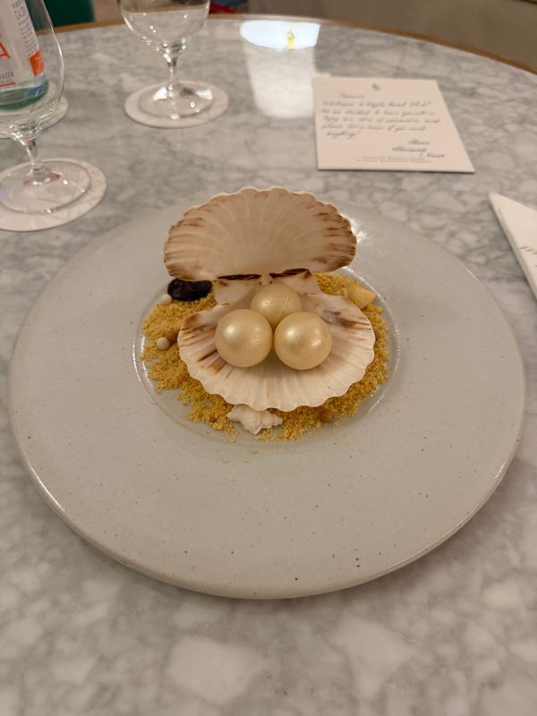 A dessert in a scallop shell, the Preferred Partner welcome amenity, delivered to the room