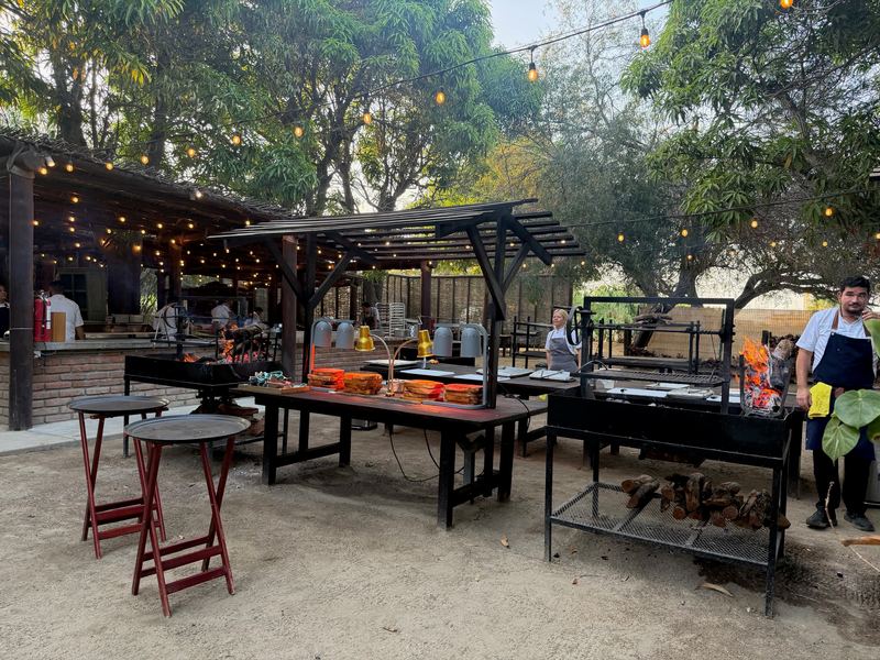 The open-fire kitchen under the trees at The Nursery