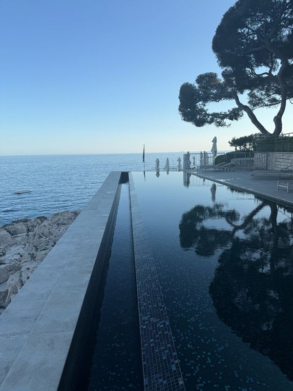 The infinity pool at Les Roches Blanches, Cassis, at the water's edge at first light