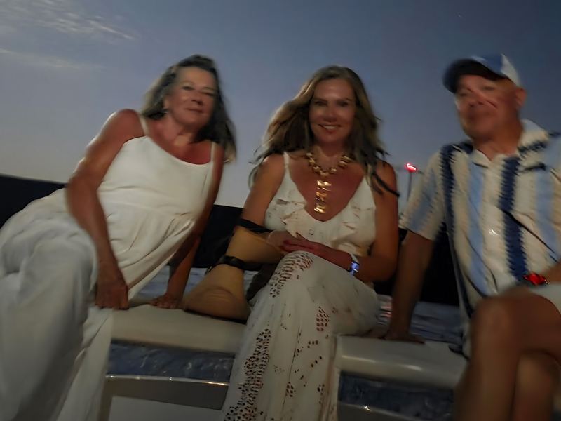 The family on the tender after dinner, night on the water
