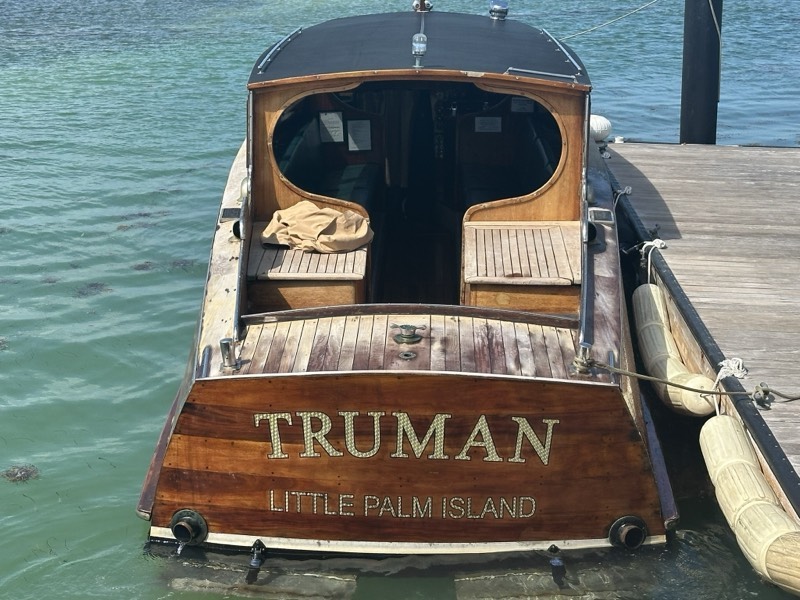The Truman, Little Palm Island's varnished timber launch, moored at the dock